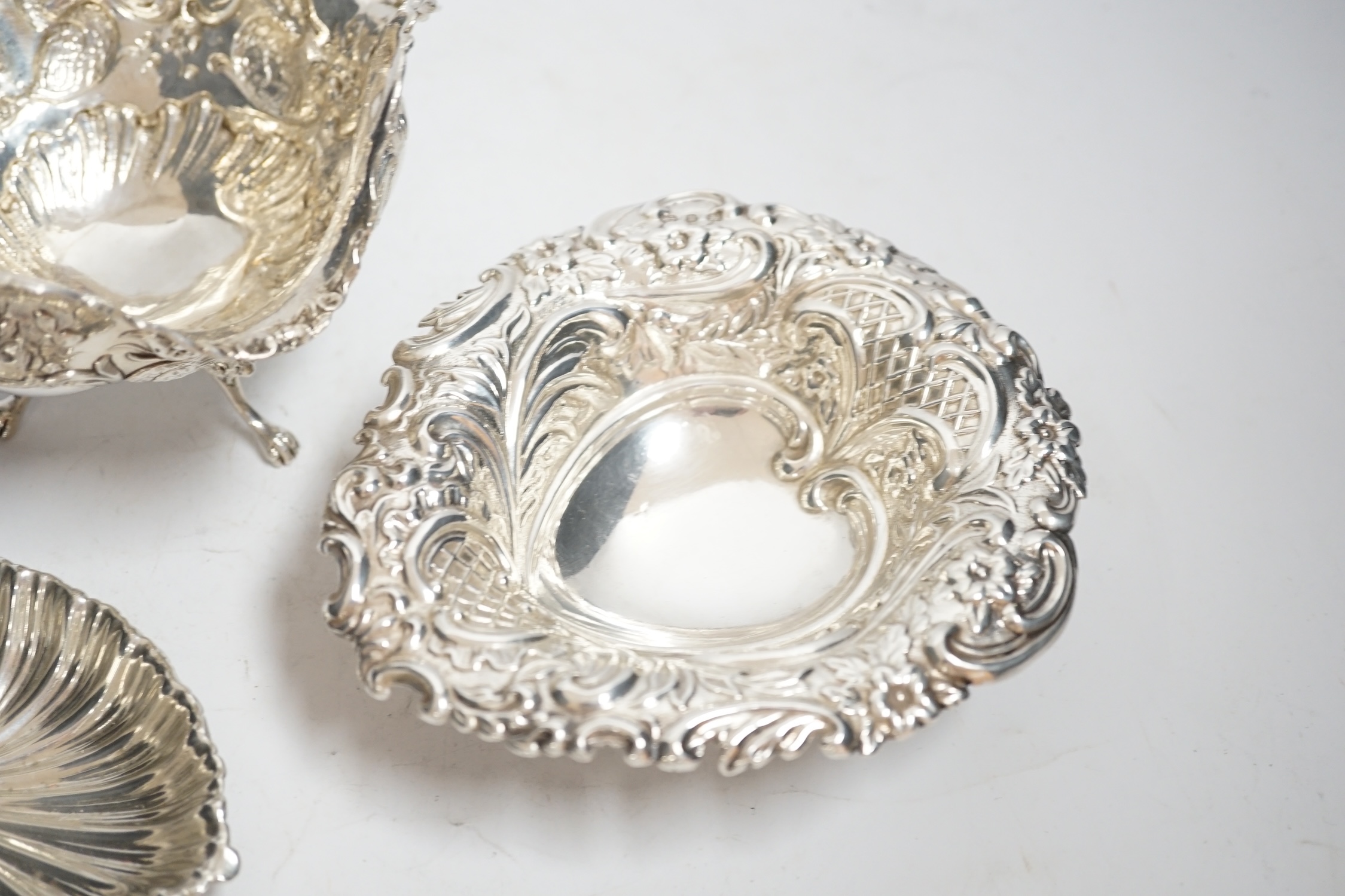 A late Victorian repousse silver heart shaped dish, I.S. Greenburg & Co, Birmingham, 1894, 14.3cm, a small silver dish and Hanau white metal bowl, 12.1oz.
